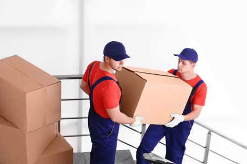 Moving crew loading boxes and furniture for a Stepney property