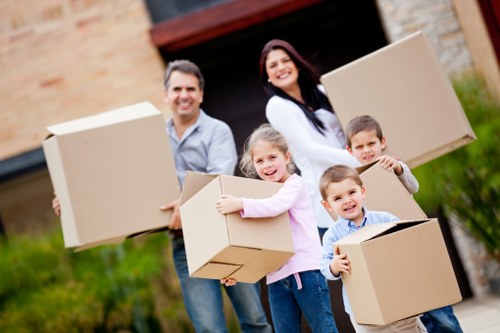 Packed office boxes and labelled furniture ready for a Stepney commercial move