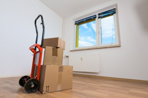 Boxes and office furniture prepared for a Stepney business relocation